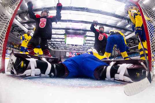 Players of Japan celebrate scoring 5-4