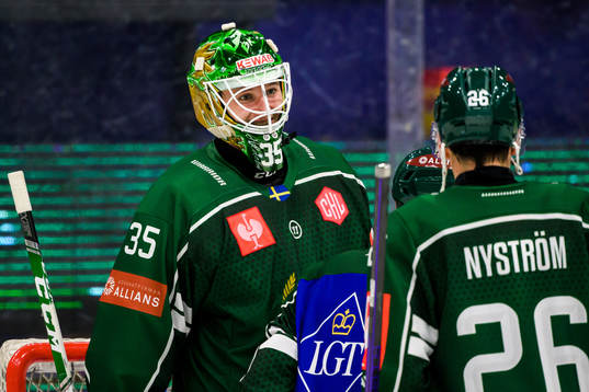 Färjestad goaltender Dennis Hildeby celebrates with