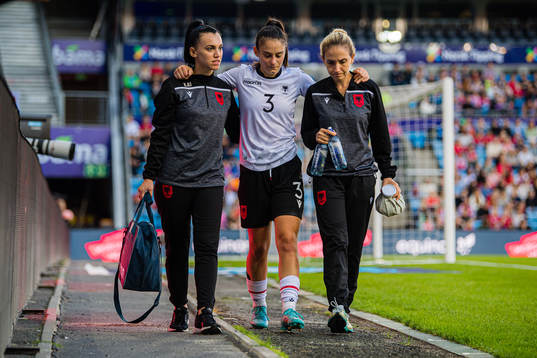 Arbenita Curraj of Albania leaves the pitch with an injury