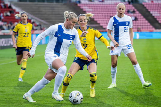 Kosovare Asllani of Sweden and Elli Pikkujämsä of Finland