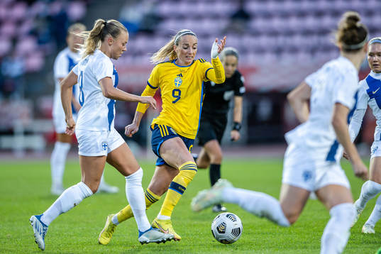 Olga Ahtinen of Finland and Kosovare Asllani of Sweden