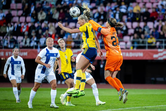 Stina Blackstenius of Sweden and goalkeeper Tinja-Riikka