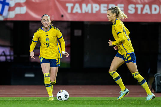 Kosovare Asllani and Nathalie Björn of Sweden