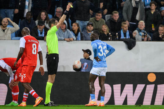 Mohamed Buya Turay of Malmö FF is shown a yellow card by