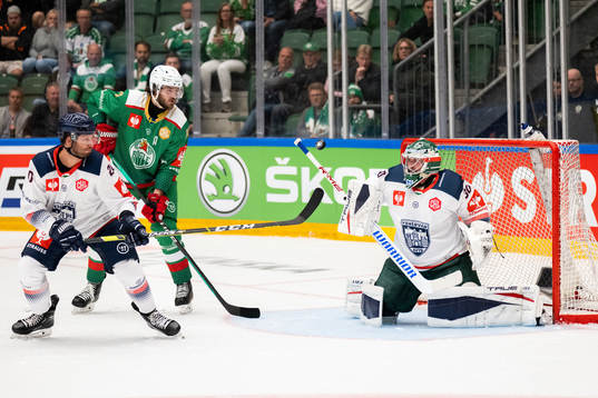 Dennis Everberg of Rögle against goalkeeper Olivier Roy