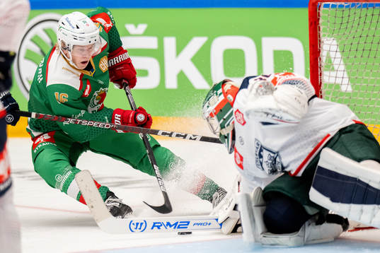 Theodor Niederbach of Rögle against goalkeeper Olivier Roy
