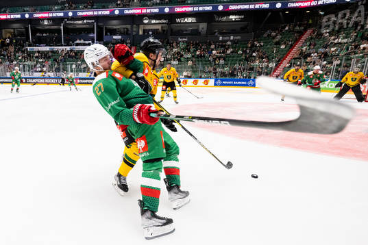 Linus Sjödin of Rögle in action with Teemu Pulkkinen of