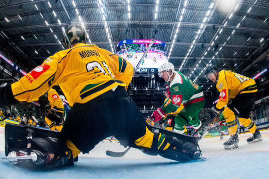 Brady Ferguson of Rögle against goalkeeper John Murray and