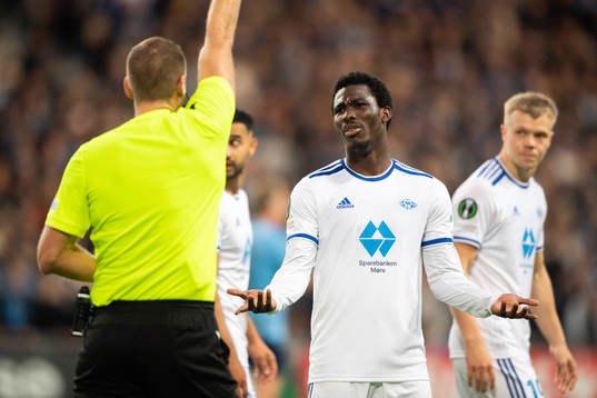 David Fofana of Molde is shown a yellow card
