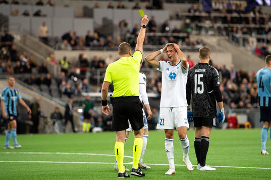 Magnus Grødem of Molde is shown a yellow card