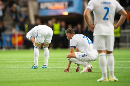 Players of Molde look dejected