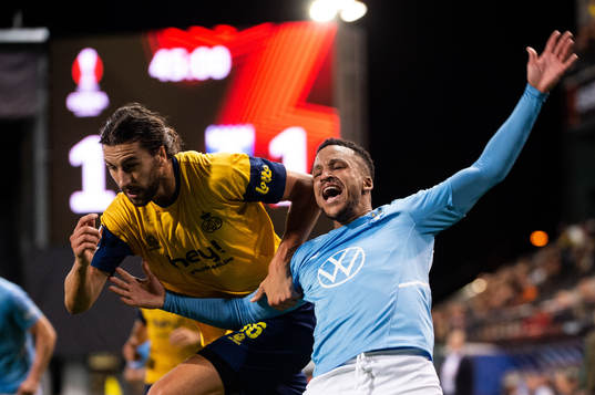 Martin Olsson of Malmö FF and Christian Burgess of Royale