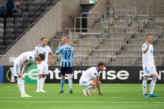Players of Molde look dejected