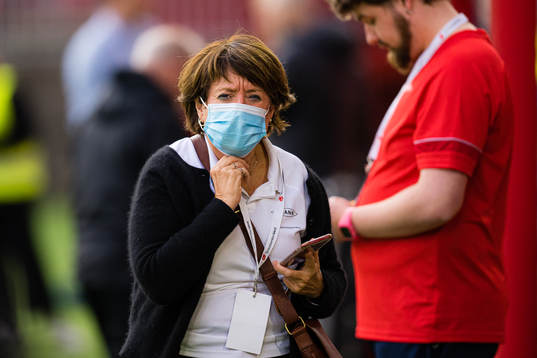 Mette Hammersland, of Brann, wearing a face mask