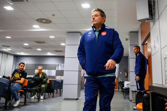 Head coach Dragan Stojkovic arrives for a press conference
