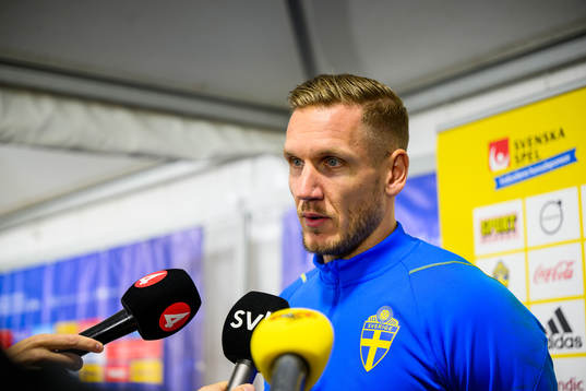 Goalkeeper Robin Olsen is interviewed by the media