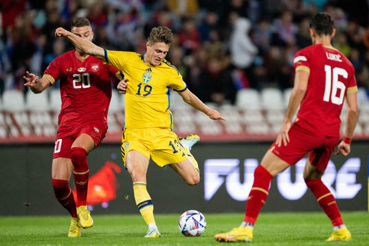Sergej Milinkovic-Savic of Serbia and Mattias Svanberg of
