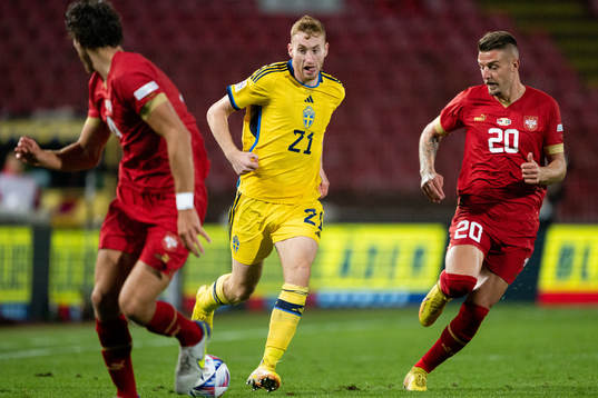 Dejan Kulusevski of Sweden and Sergej Milinkovic-Savic of
