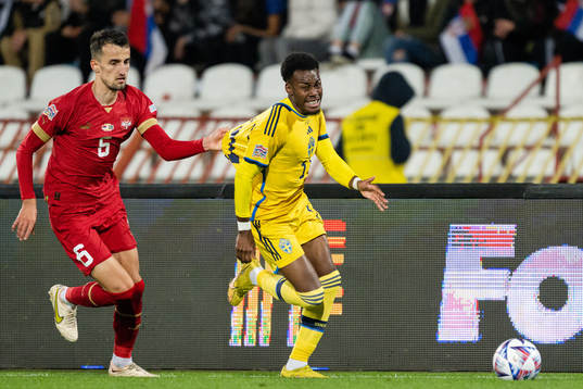 Erhan Masovic of Serbia and Anthony Elanga of Sweden