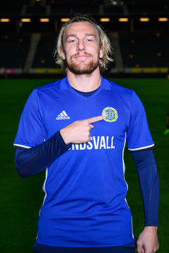 Emil Forsberg poses for a portrait with the jersey of his