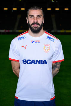 Mikael Ishak poses for a portrait with the jersey of his