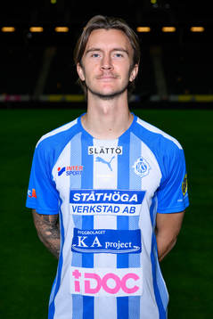Kristoffer Olsson poses for a portrait with the jersey of