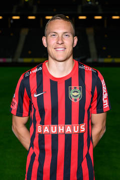 Ludwig Augustinsson poses for a portrait with the jersey of