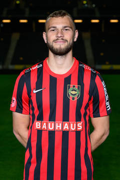 Jesper Karlström poses for a portrait with the jersey of
