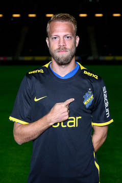 Daniel Sundgren poses for a portrait with the jersey of his