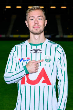 Joel Andersson poses for a portrait with the jersey of his