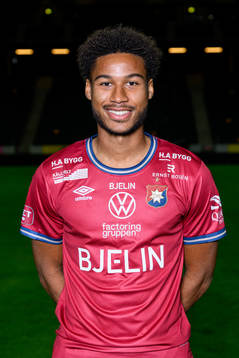 Jens Cajuste poses for a portrait with the jersey of his