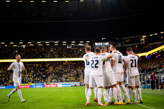 Benjamin Verbic of Slovenia celebrate with team mates