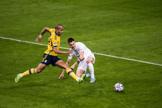 Robin Quaison of Sweden and Gregor Sikosek of Slovenia