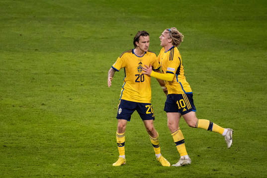 Kristoffer Olsson and Emil Forsberg of Sweden celebrate