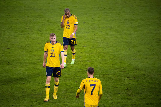 Dejan Kulusevski and Robin Quaison of Sweden looks dejected