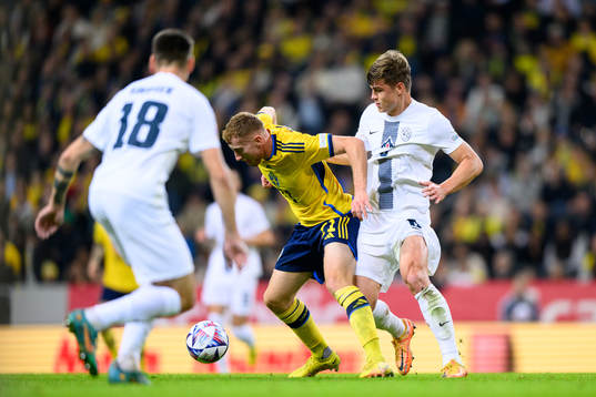 Dejan Kulusevski of Sweden and Jaka Bijol of Slovenia