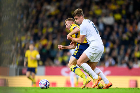 Dejan Kulusevski of Sweden and Jaka Bijol of Slovenia