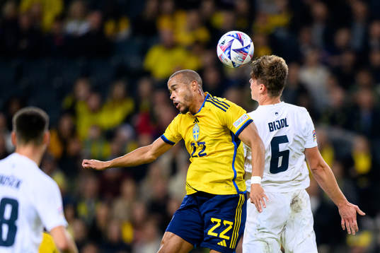 Robin Quaison of Sweden and Jaka Bijol of Slovenia