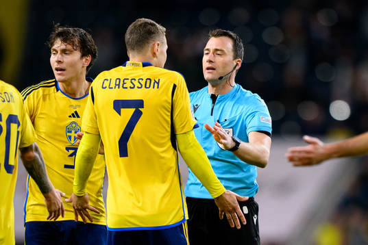 Viktor Claesson of Sweden talks to Referee Felix Zwayer