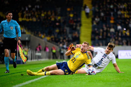 Dejan Kulusevski of Sweden and Jaka Bijol of Slovenia