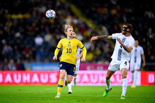 Emil Forsberg of Sweden and Miha Blazic of Slovenia