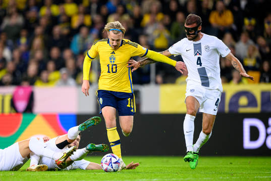 Emil Forsberg of Sweden and Miha Blazic of Slovenia
