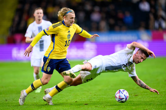 Emil Forsberg of Sweden and Benjamin Verbic of Slovenia