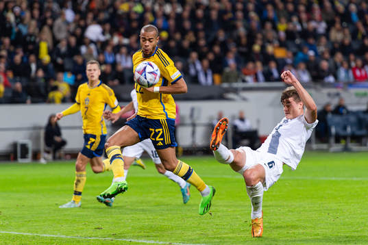 Robin Quaison of Sweden and Jaka Bijol of Slovenia