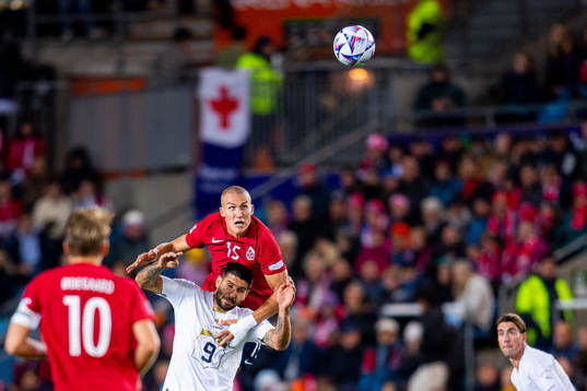 Aleksandar Mitrovic of Serbia and Leo Skiri Østigård of