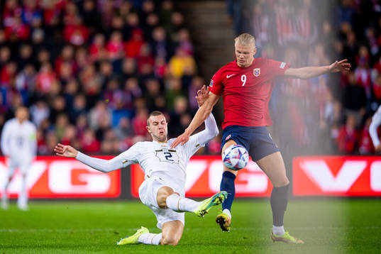 Strahinja Pavlovic of Serbia and Erling Braut Haaland of