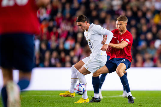 Dusan Vlahovic of Serbia and Kristoffer Ajer of Norway