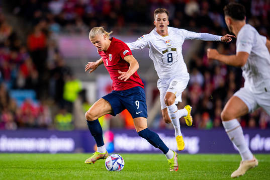 Erling Braut Haaland of Norway and Ivan Ilic of Serbia