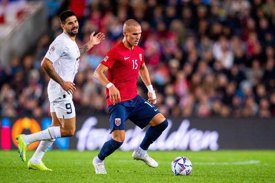 Aleksandar Mitrovic of Serbia and Leo Skiri Østigård of