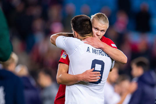 Erling Braut Haaland of Norway and Aleksandar Mitrovic of